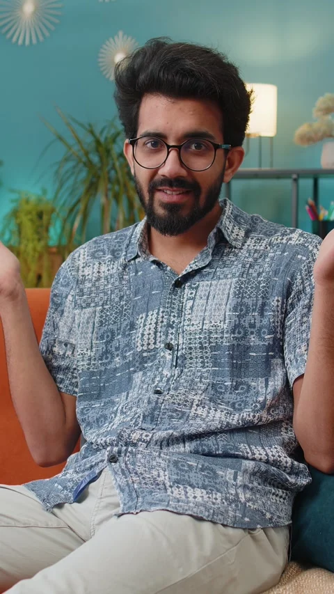 Indian man boy asking why, what reason of failure demonstrating disbelief Stock Footage 347055761