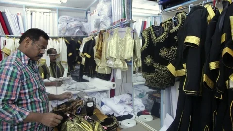 Indian man choosing clothes in the store Video stock 74183894