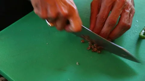Indian man chopping local vegetable on the chopping board. Stock Footage 49614080