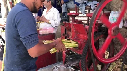 Indian Man Create Juice from A Machine Stock Footage 105189061