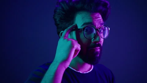 Indian man developer coding worker computer smart clever hacker in glasses neon Stock Footage 242433962