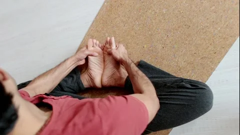 Indian man doing yoga while inside the house on the floor. Stock Footage 151720303