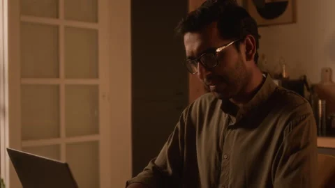Indian Man in Glasses Programming on Laptop at Home Vídeo Stock 299583703