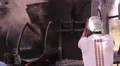 Indian man handling an old oven outside HD Footage