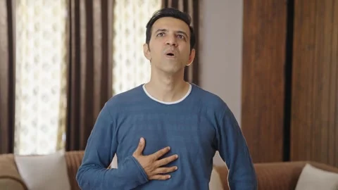 Indian man having acidity problem after eating Stock Footage 242407768