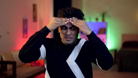 An Indian man having bad headache and not feeling well - work stress, pain, s... Stock-Footage 264029887