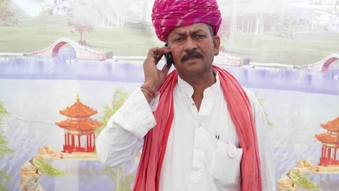 Indian man having a serious conversation on the phone Video stock 69788320