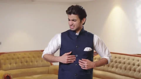 Indian man having stomach acidity problem Stock Footage 240006722