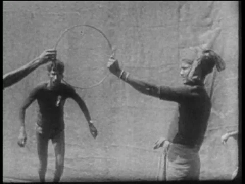 Indian Man jumping through hoop 1930 stunt archival footage Stock Footage 79007321