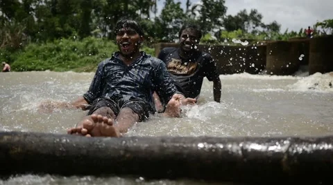 Indian man making big splash of water Video stock 59824534