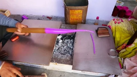 Indian Man Making cheap plastic bracelets near Samode Palace. Handmade trad.. Stock Footage 74592712