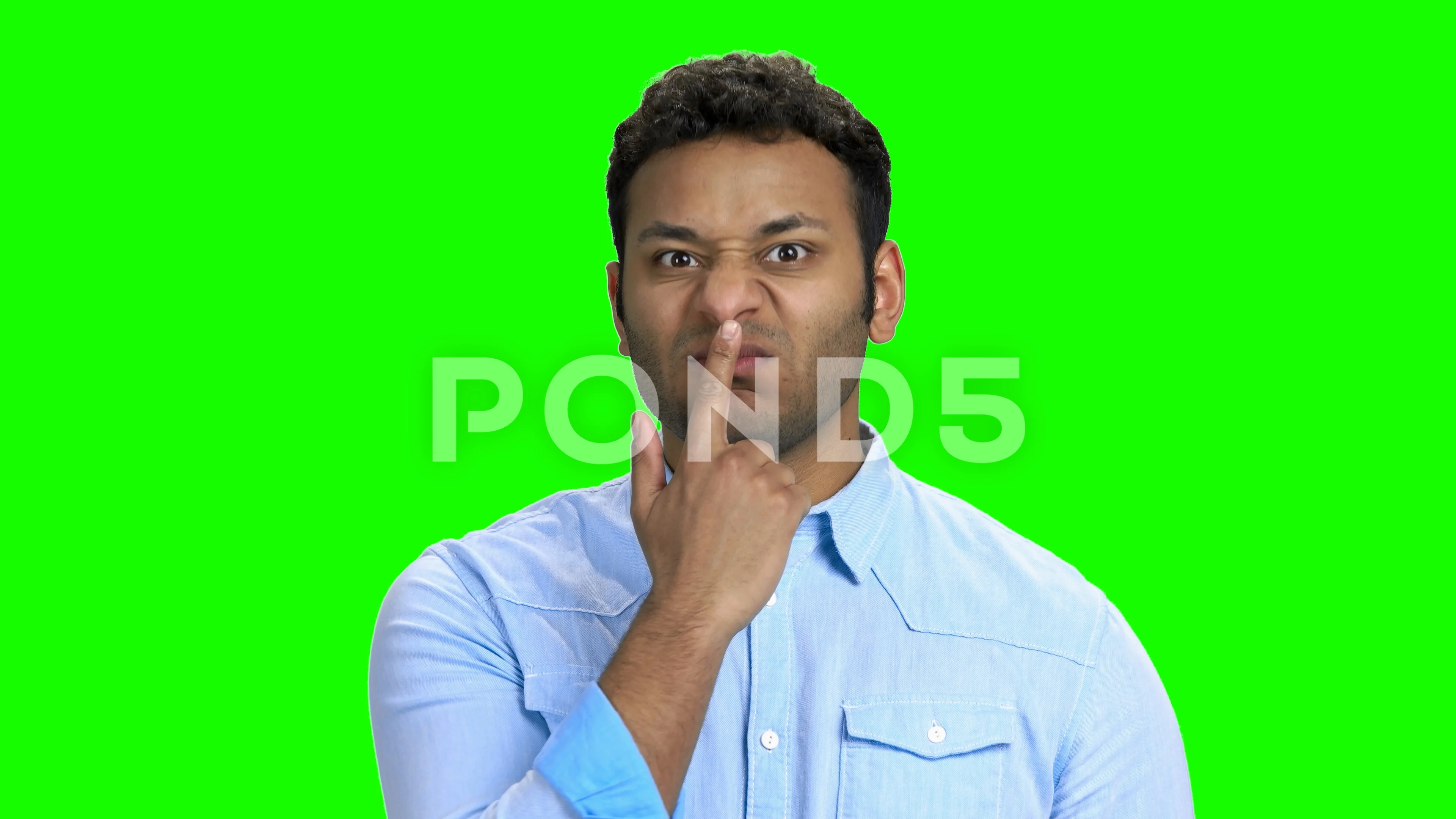 Indian man making funny faces on green s... | Stock Video | Pond5