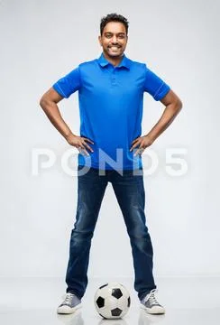 Indian man or football fan with soccer ball Stock Photos