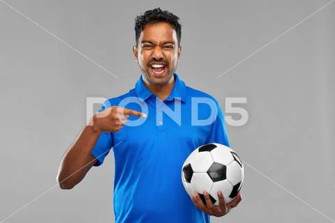 Indian man or football fan with soccer ball Stock Photos