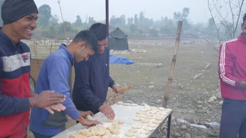 Indian man in outdoor Kitchen preparing to make Indian bread Roti or Chapati in 스톡 동영상 172341830