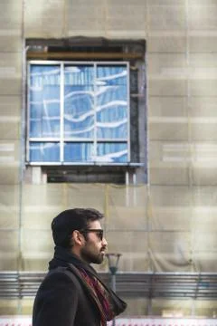 Indian man posing in an urban context. Stock Photos