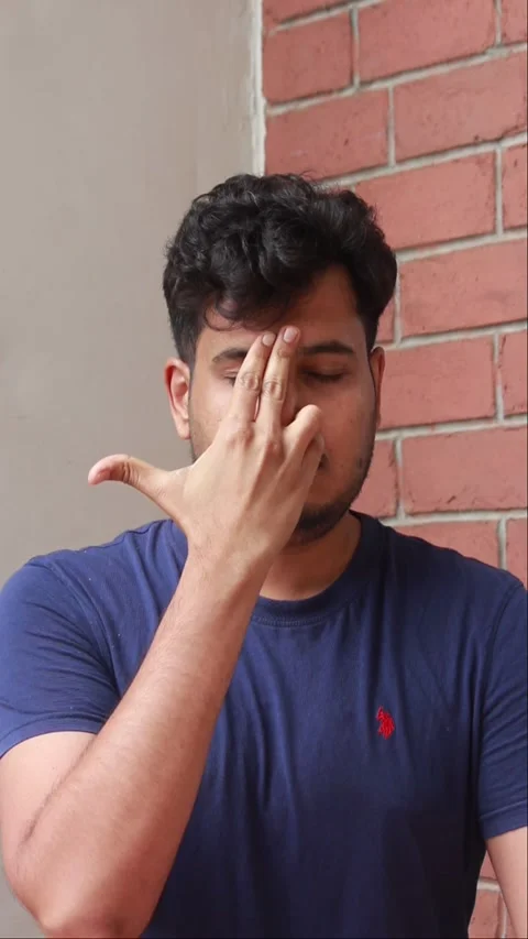 Indian man is practicing yoga and breathing excercise. he is doing nadi shodhana Stock Footage 278272154