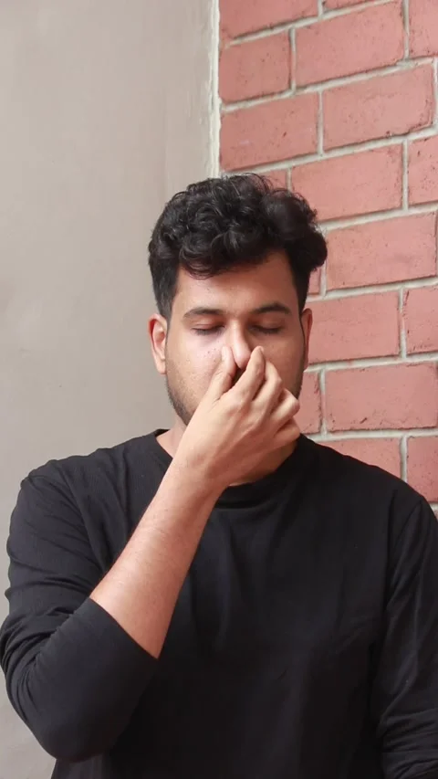 Indian man is practicing yoga and breathing excercise. he is doing nadi shodhana Stock Footage 278273019