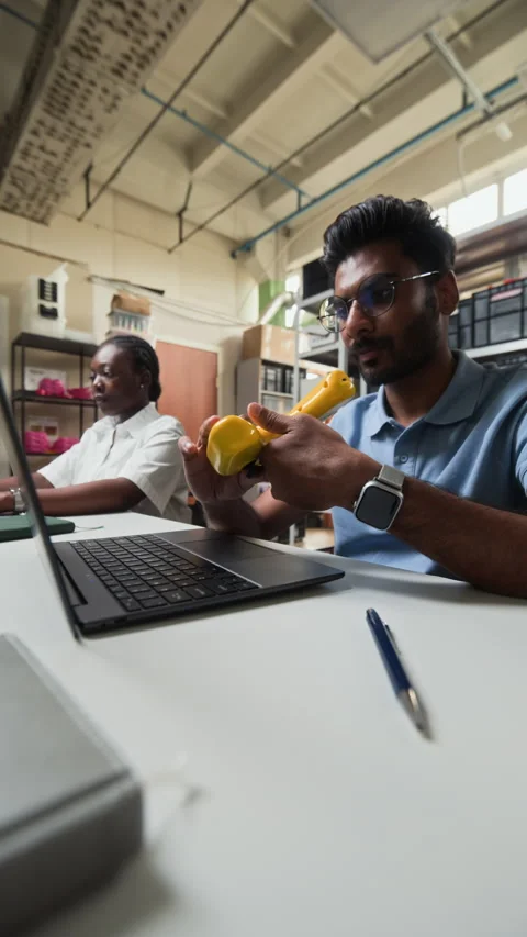 Indian Man Programming Robotic Controller with Laptop in Laboratory Vídeo Stock 343522630