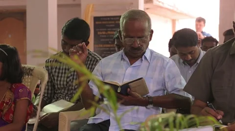 Indian man reading from the Bible Stock Footage 49322244