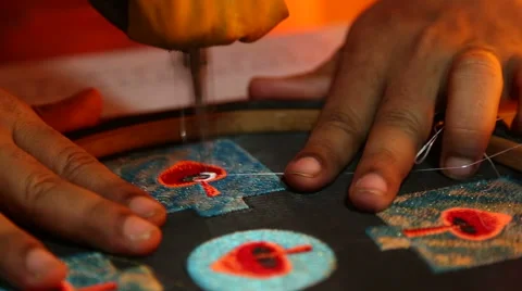 Indian man sewing ornament using sewing machine in workshop. Stock Footage 49759622