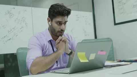 Indian man sit in office use laptop check email read fantastic news. Stock Footage 169386076