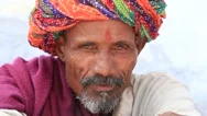 Indian Man, Sits On The Ghat Along The Sacred Sarovar Lake. Pushkar, India Stock Footage