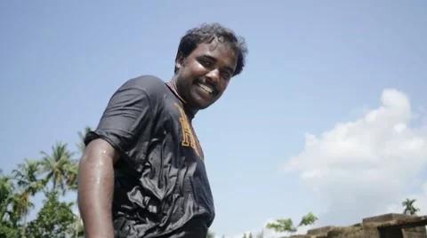 Indian man smiling with sky as background Stock Footage 59835767