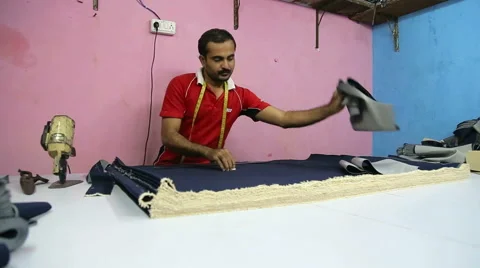Indian man sorting textile in textile factory in Mumbai. Video stock 49365352