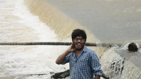 Indian man standing by the river Stock Footage 59823250