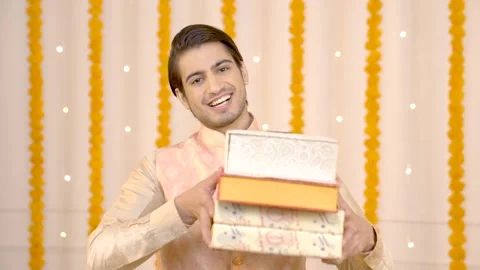 Indian man with sweet boxes Stock Footage 249399191
