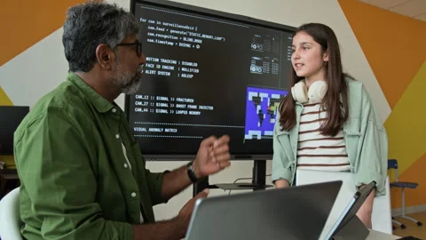 Indian Man Teaching Coding to Teenage Girl in Computer Class Stock Footage 342820768
