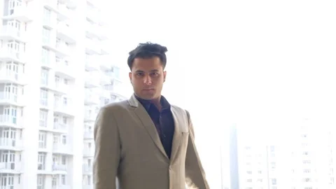 Indian man turns and points an accusing finger right before returning back Stock Footage 100529979