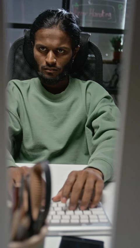 Indian Man Typing on Computer Keyboard Working in Office Stock Footage 348369832