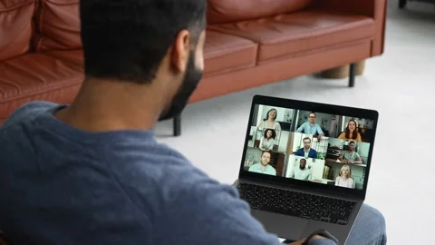 Indian man using computer app for communicating with many people at same time Video stock 192980084