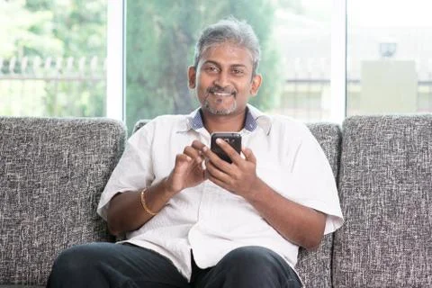 Indian man using smart phone Stock Photos