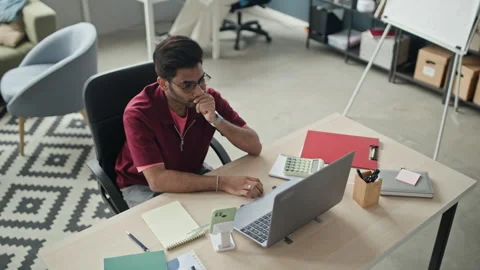 Indian Man Working on Laptop, Solving Business Problems Stock Footage 338330245