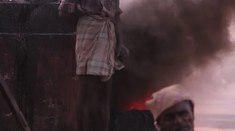Indian man working outside at an oven Stock Footage 49321870