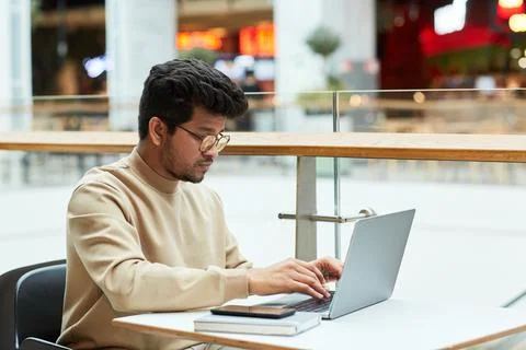 Indian Man Working Remotely Stock Photos