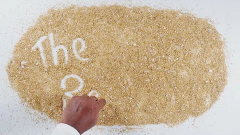 An Indian man's Hand Writes On Beach Sand words The restaurant Stock Footage 248661069