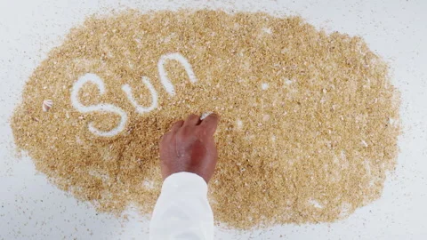 An Indian man's Hand Writes On Beach Sand words Sun and fun Stock Footage 248661754