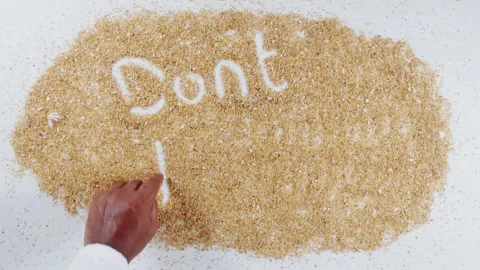 An Indian man's Hand Writes On Beach Sand words Don't pollute Stock Footage 248667314