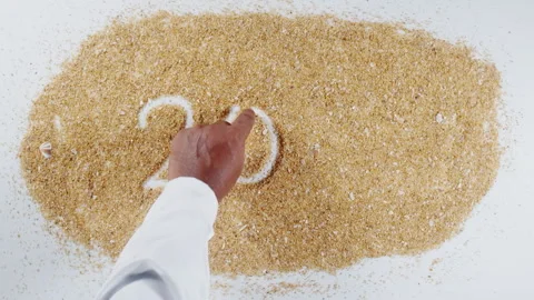 An Indian man's Hand Writes On Beach Sand words 2026 Stock Footage 248669004