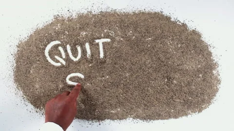 An Indian man's Hand Writes On black pepper words Quit smoking Stock Footage 248675625