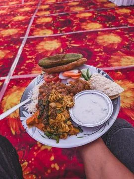 Indian meal on a patterned carpet Stock Photos