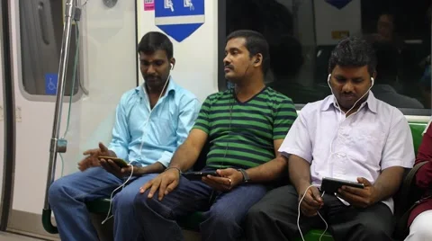 Indian Men Using Smartphones in Subway in City Видео 67282275