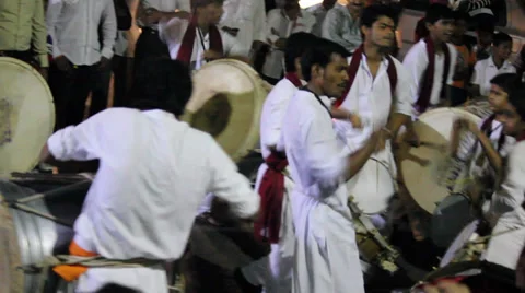 Indian men wearing headgear called feta &amp; kurta pajamas and playing Dhol Stock Footage 33779770