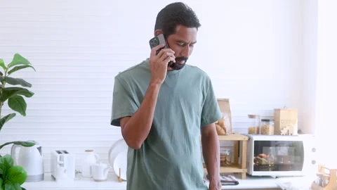 Indian middle-aged man, freelancer, business people talking to mobile phone.. Stock Footage 254657992