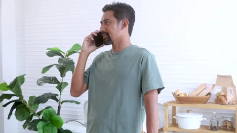 Indian middle-aged man, freelancer, business people talking to mobile phone.. Stock Footage 254658041