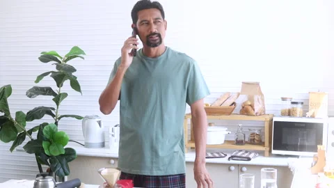 Indian middle-aged man, freelancer, business people talking to mobile phone.. Stock Footage 254680874